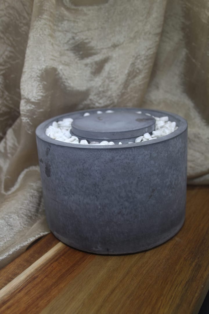 Elegant handmade concrete tabletop fire pit.